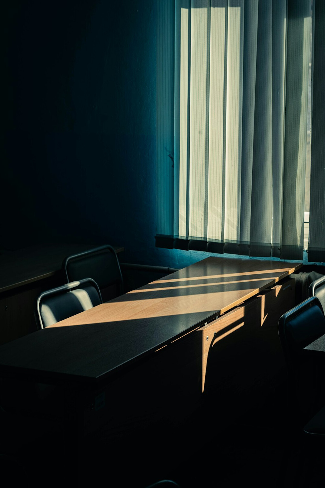 writer sitting at old wooden desk
